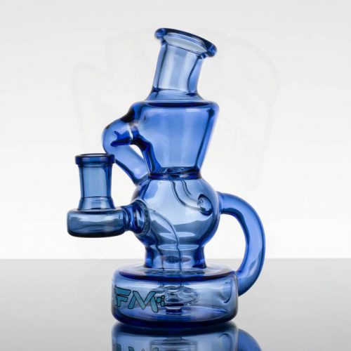 AFM 6.5in Color Recycler - Ink Blue Alien Flower Monkey offers a wide range of oil rigs and smaller water pipes with a variety of perc styles featuring trees, showerheads, recyclers, and many more! | Recycler | Perc: Multi-hole | Joint Size: 14mm female grindless | Height: 6.5" | Label: Blue AFM logo with black outline | Color: Ink Blue | Includes: Slide | Designed and Assembled in California by Alien Flower Monkey